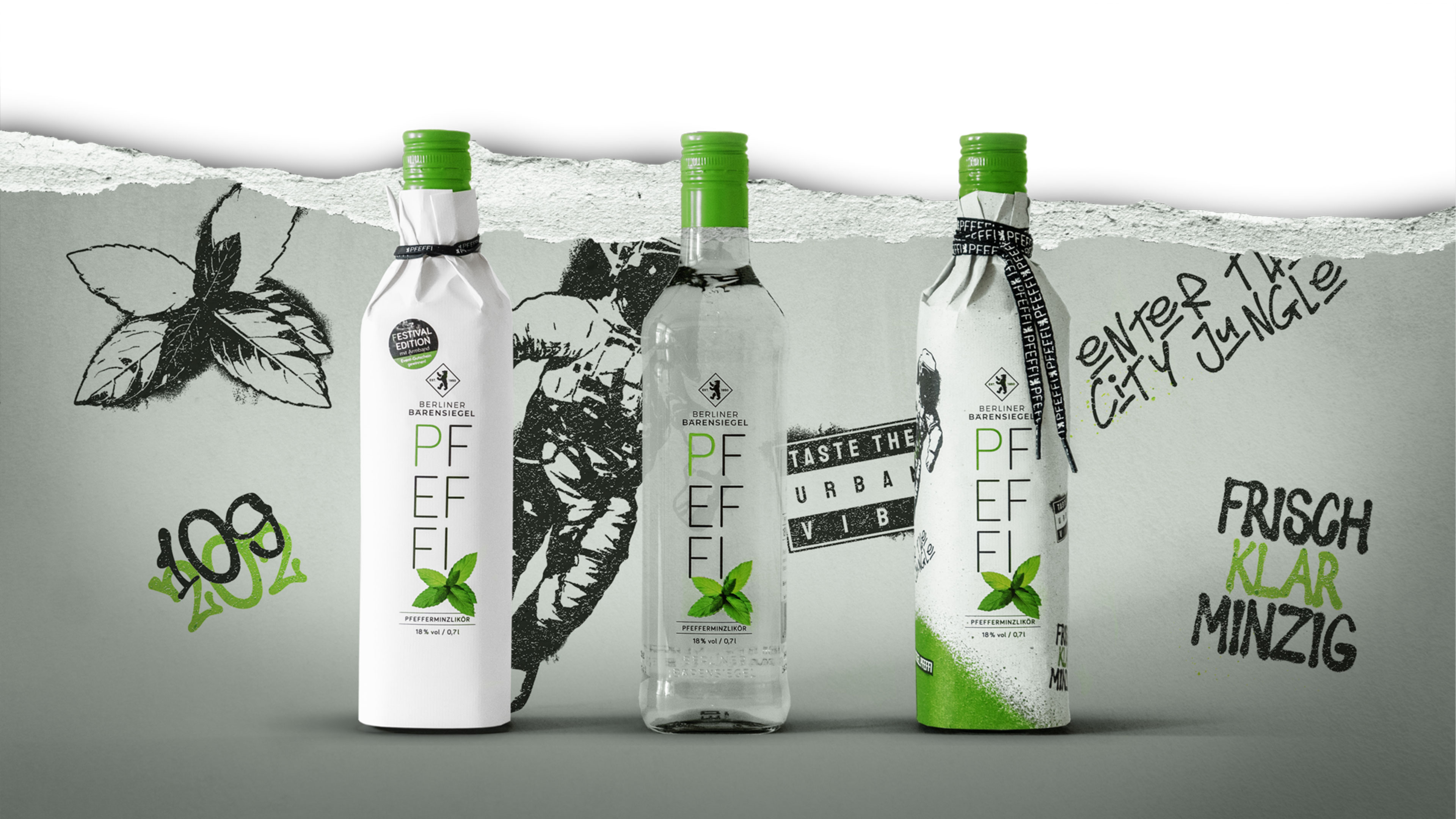 Paperwrapflaschen vor besprühtem Hintergrund